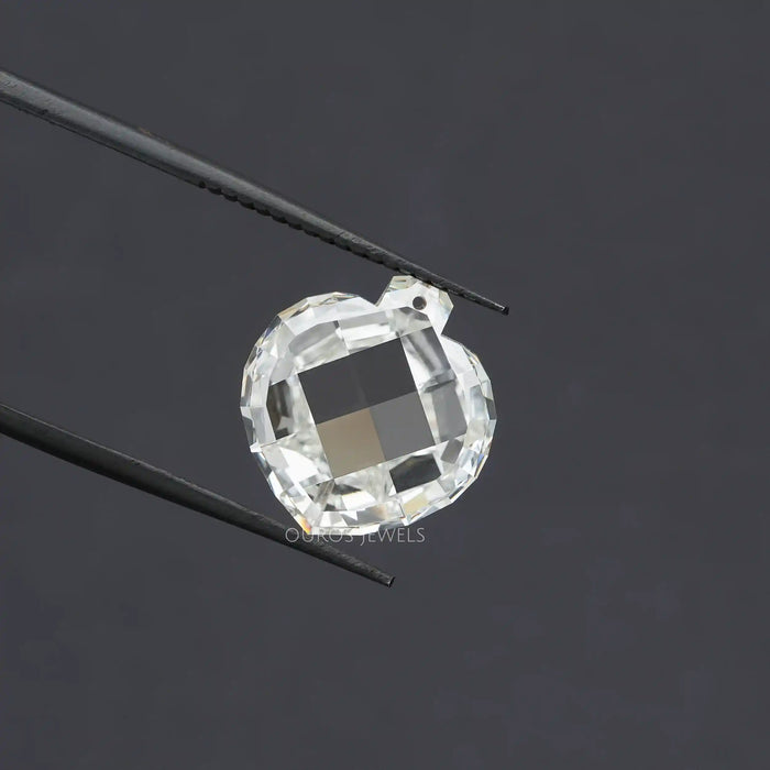 Rose cut heart lab created diamond in tweezer