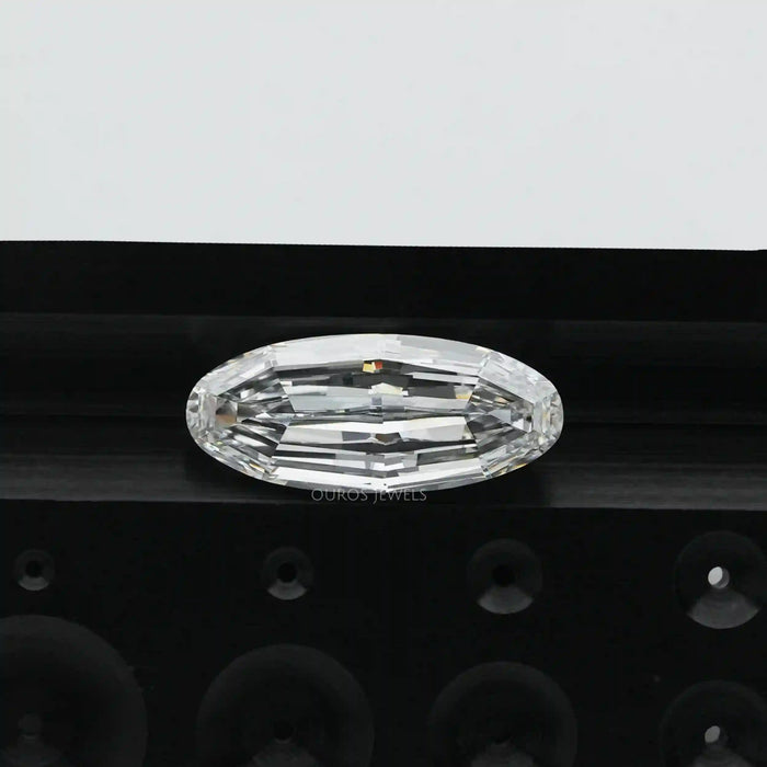 [ an oval cut diamond on top of a black background]-[Ouros Jewels]