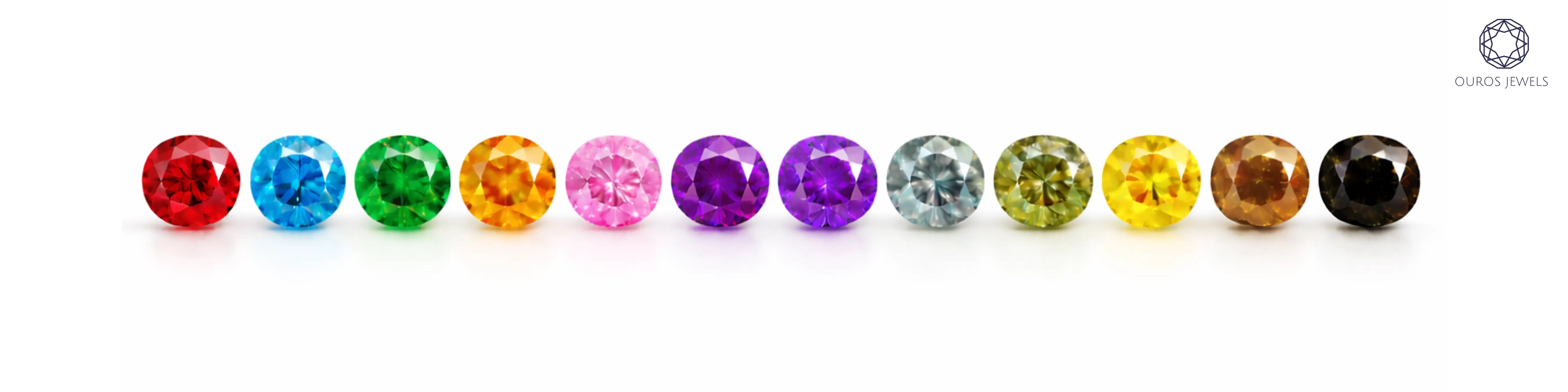 All 12 fancy coloured diamonds ranked by rarity — red, blue, green, orange, pink, violet, purple, grey, olive, yellow, brown, and black round-cut diamonds by Ouros Jewels