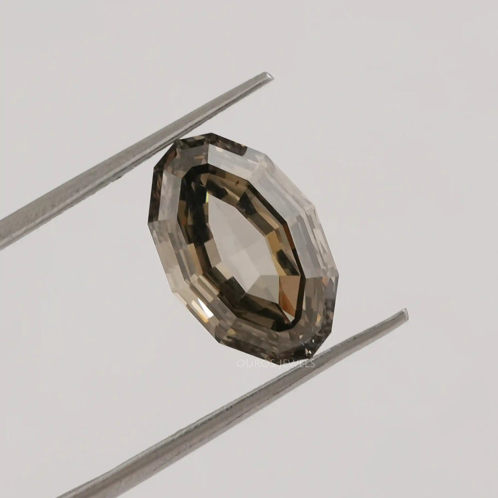 Oval Step Cut Loose Diamond in a Tweezer