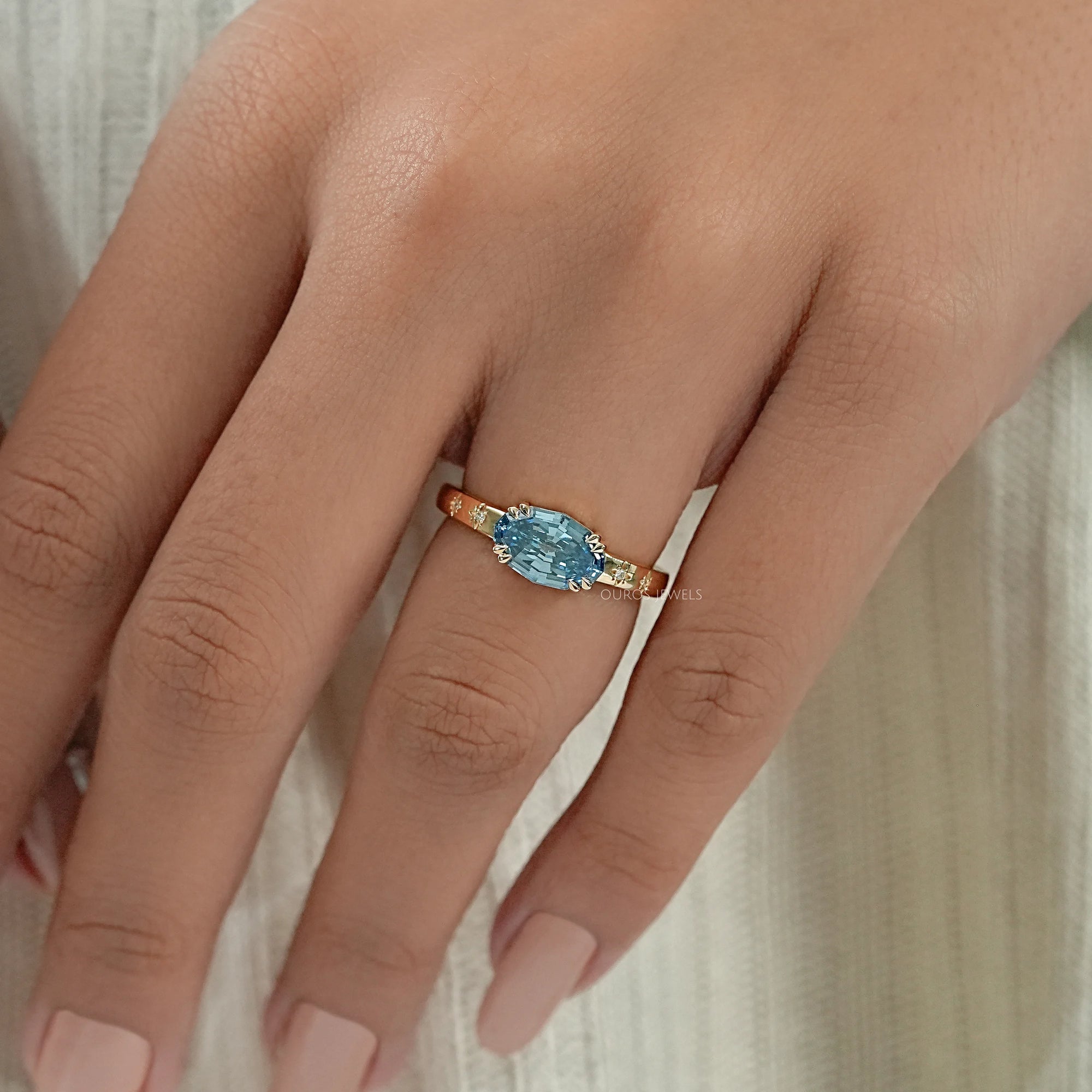 East-West Blue Step Cut Oval Accent Diamond Ring