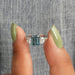 [A Women wearing Blue Diamond Emerald Cut Engagement Ring]-[Ouros Jewels]