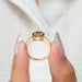 [A Women holding Cat Cut Bezel Set Engagement Ring]-[Ouros Jewels]
