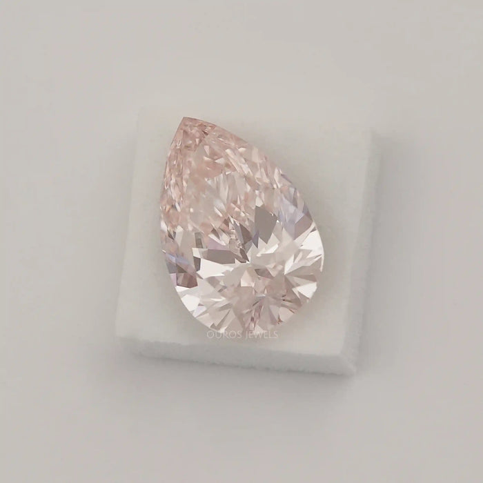 Pink Pear Certified Loose Diamond on White Surface. 