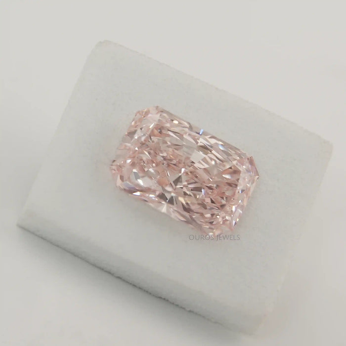 Certified Pink Diamond on White Surface 
