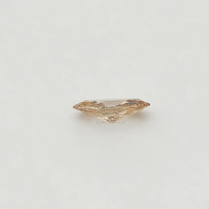 Side View of Champagne Diamond Marquise Diamond in a Tweezer.