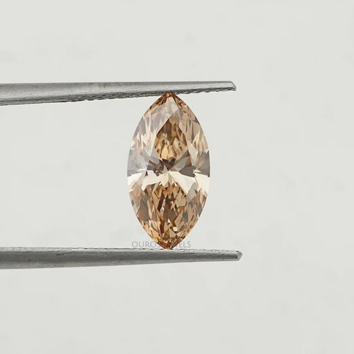 Marquise Champagne Colored DIamond in a Tweezer.