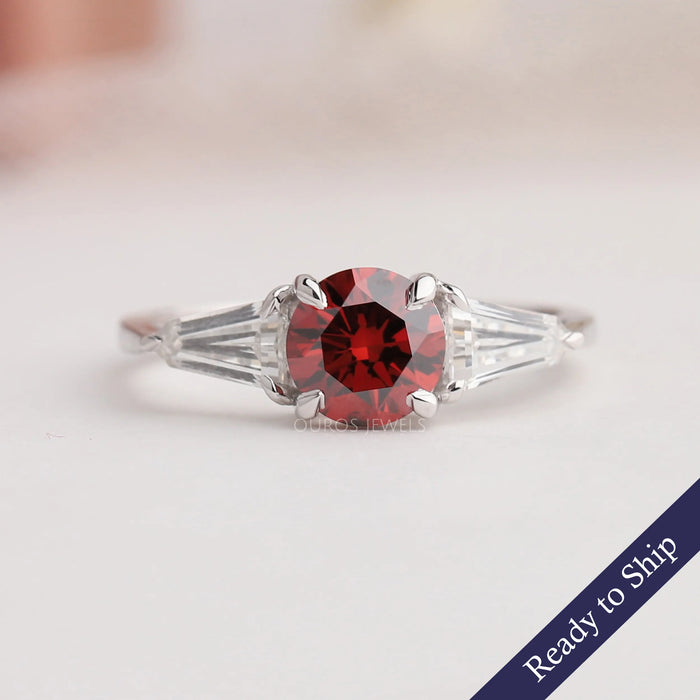 Red round cut three stone lab grown diamond engagement ring with bullet cut side stones in 14k white gold