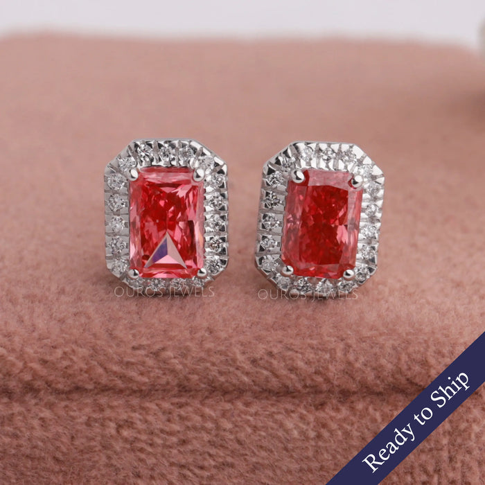 Pink radiant cut lab grown diamond stud earrings with halo of round diamonds in 14k white gold