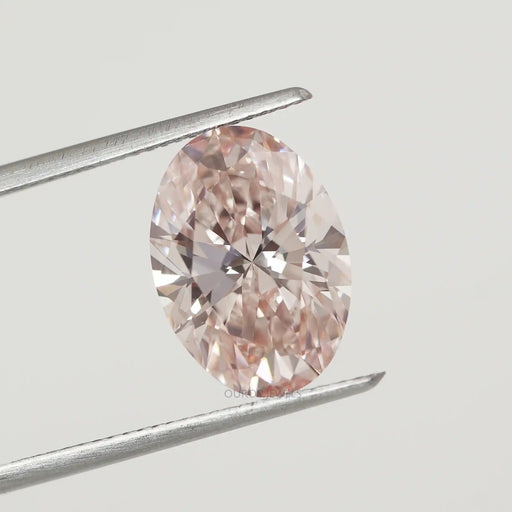 Certified Pink Oval Diamond in a Tweezer 