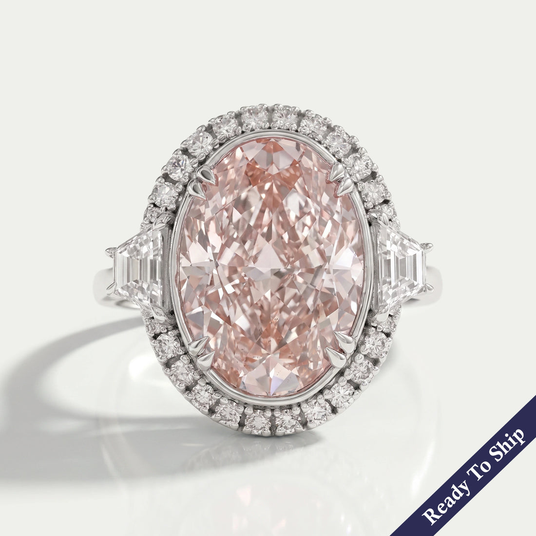 Pink Oval Cut With Trapezoid Accent Halo Engagement Ring Rings