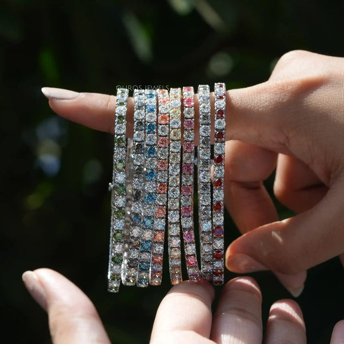 [A Women holding Fancy Colored Lab Diamond Tennis Bracelet]-[Ouros Jewels]