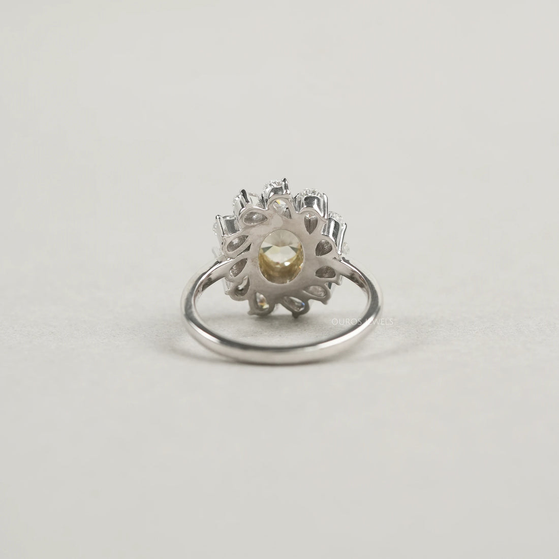 Yellow Oval Bezel Set Diamond With Pear Halo Ring