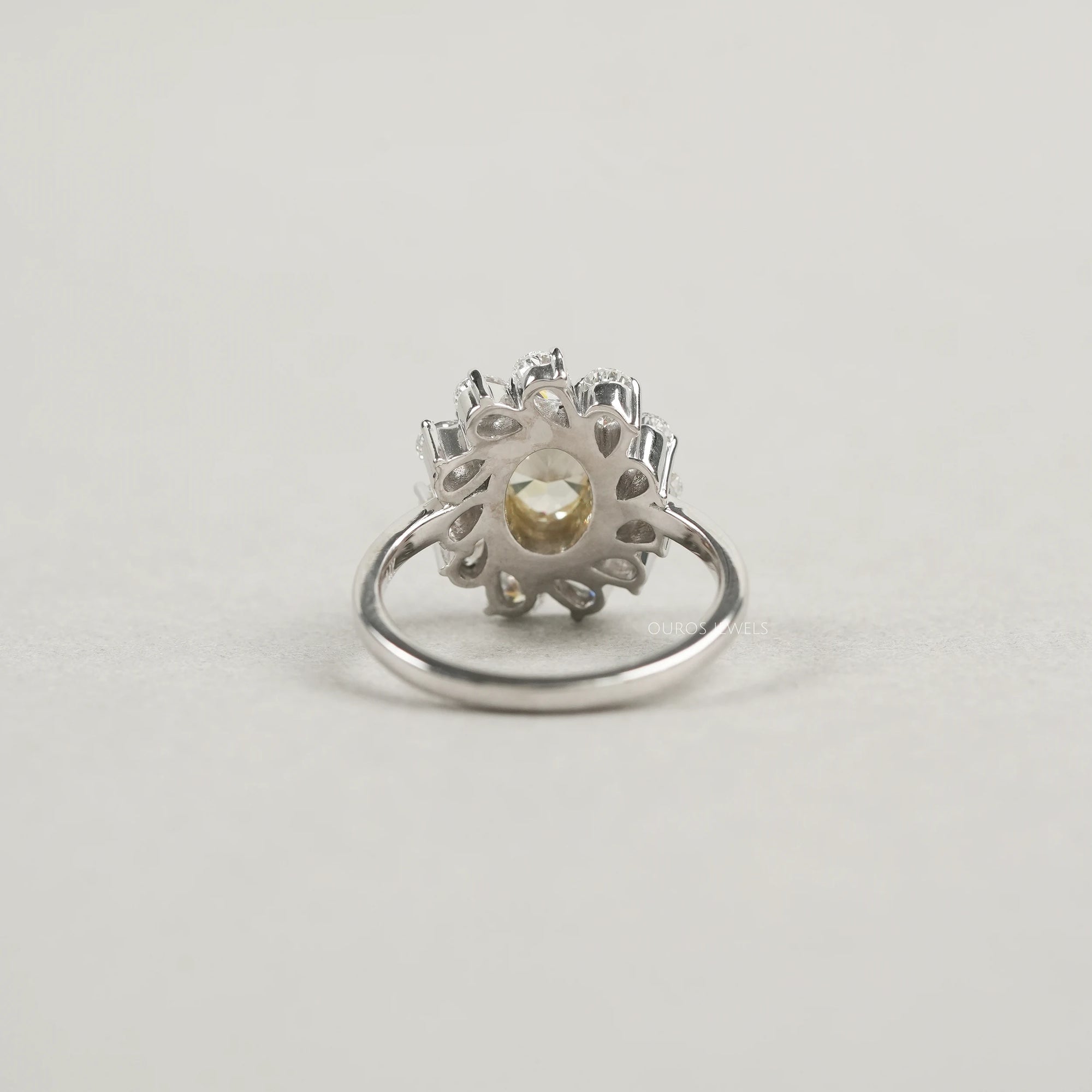 Yellow Oval Bezel Set Diamond With Pear Halo Ring