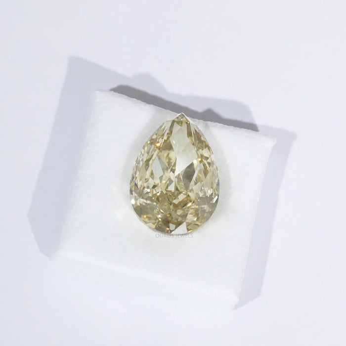 Modified Pear Cut Yellow Diamond on White Cloth 
