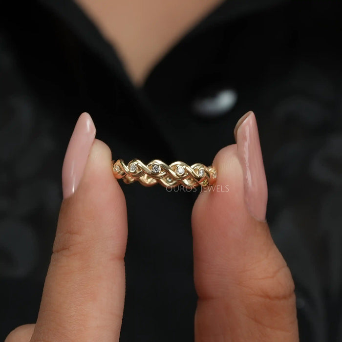 [A Women holding a Infinity Round Cut Eternity Band]-[Ouros Jewels]