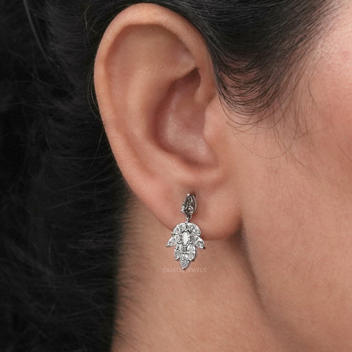 A Women wearing Olive Pear and Marquise Cut Drop Earrings 