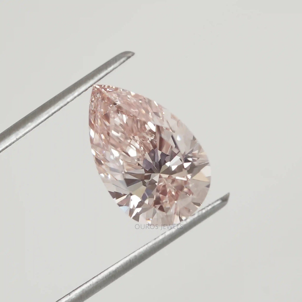 Pink Pear Shape Diamond in a Tweezer.