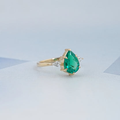 Green Pear And Kite Cut Three Stone Engagement Ring