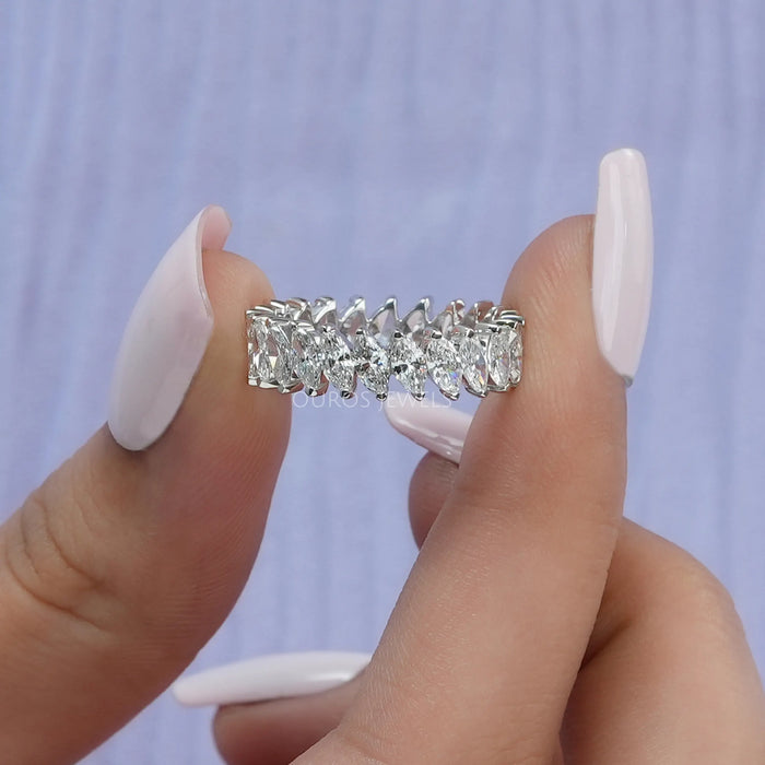 ]A Women Holding Marquise Eternity Diamond Ring]-[Ouros Jewels]