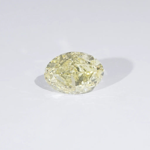 Fancy Yellow Modified Oval Cut Loose Diamond on White Surface
