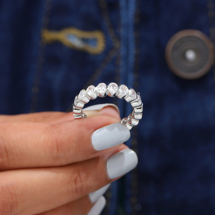 [A Women holding Oval Bezel Set Ring]-[Ouros Jewels]