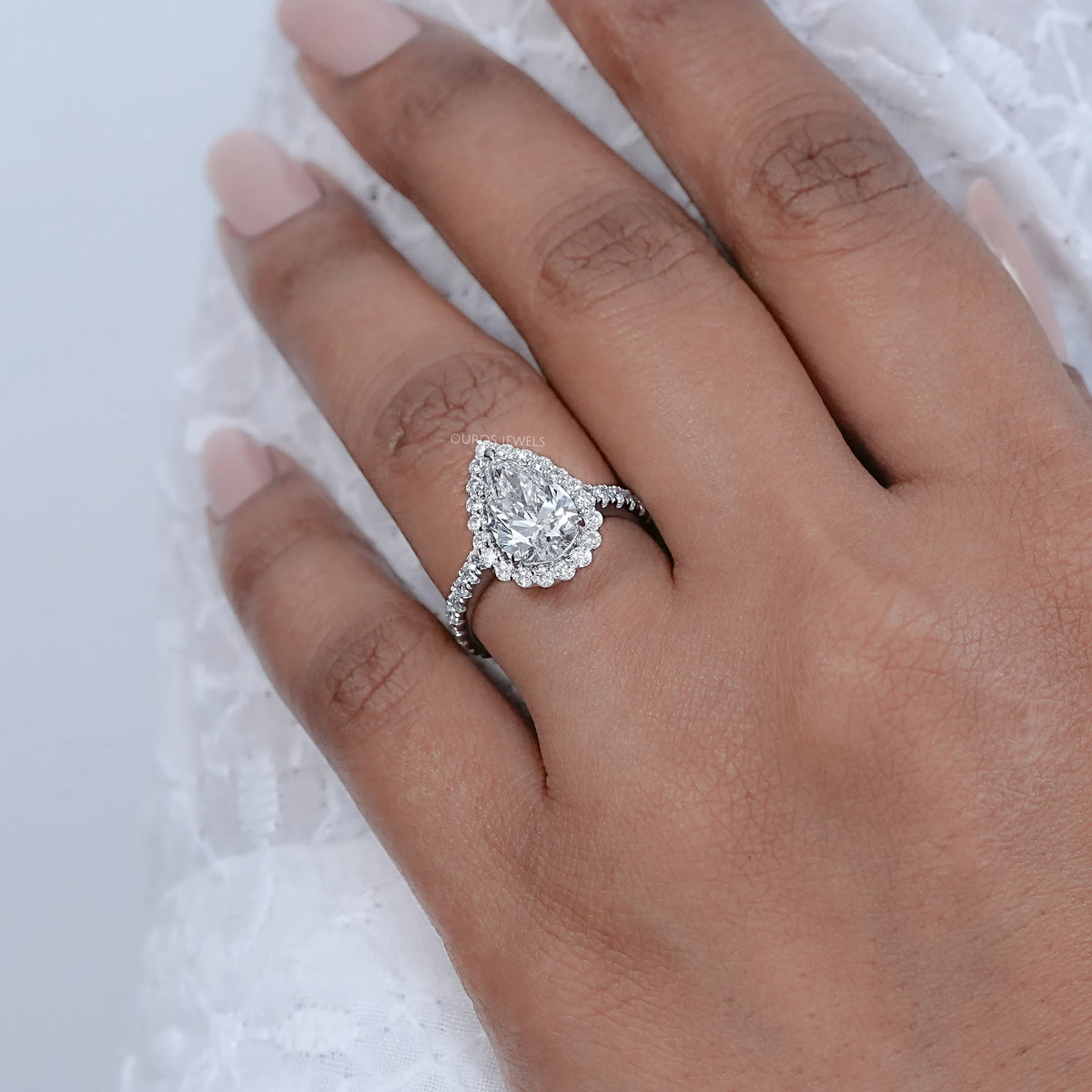 Pear Cut Halo Solitaire Accent Engagement Ring