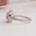 Round accent stones studded on 14k white gold split shank of pink cushion double halo engagement ring