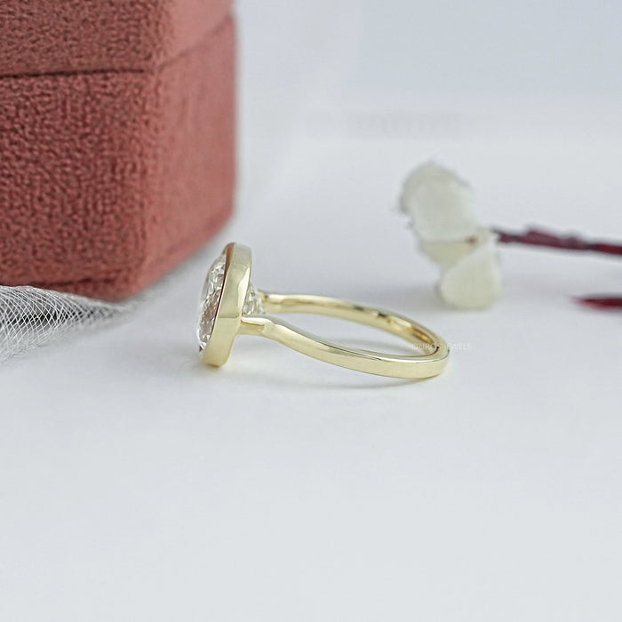 East West Portuguese Oval Bezel Set Engagement Ring