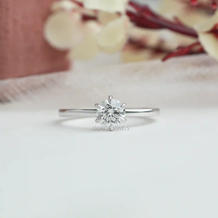 [a white gold solitaire engagement ring with a diamond in the center]-[Ouros Jewels]