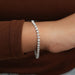 [A Women wearing Round Cut Diamond Tennis Bracelet]-[Ouros Jewels]