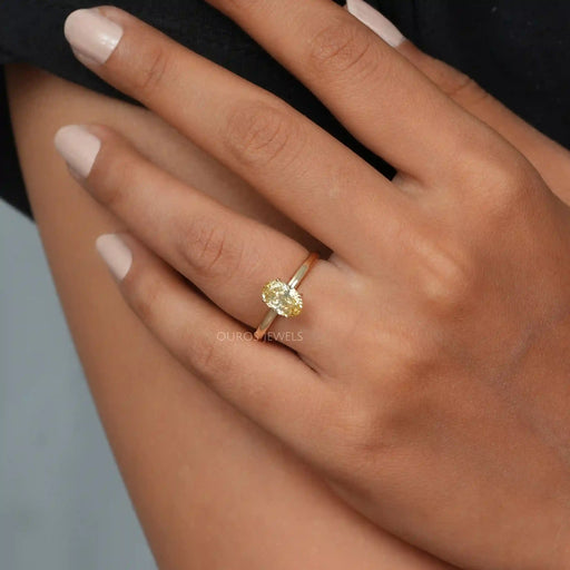 [A Women wearing Yellow Oval Cut Solitaire Engagement Ring]-[Ouros Jewels]