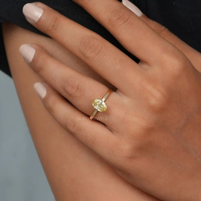 [A Women wearing Yellow Oval Cut Solitaire Engagement Ring]-[Ouros Jewels]