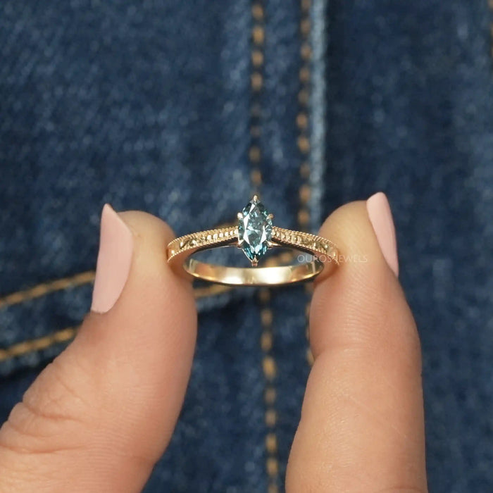 [A Women Holding Blue Marquise Cut Solitaire Engagement Ring]-[Ouros Jewels]