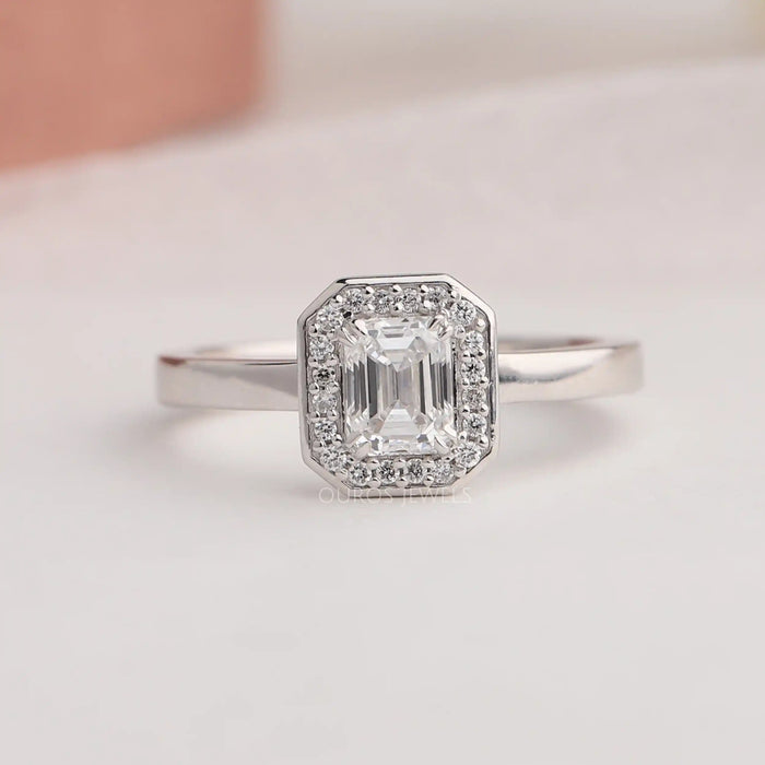 Emerald cut lab diamond engagement ring with stunning halo of round diamonds