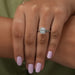 In finger look of emerald cut lab created diamond halo engagement ring