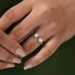 [A Women wearing Heart and Emerald Cut Toi Et Moi Ring]-[Ouros Jewels]