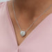 [ a women wearing halo heart pendant with diamond on it]-[Ouros Jewels]