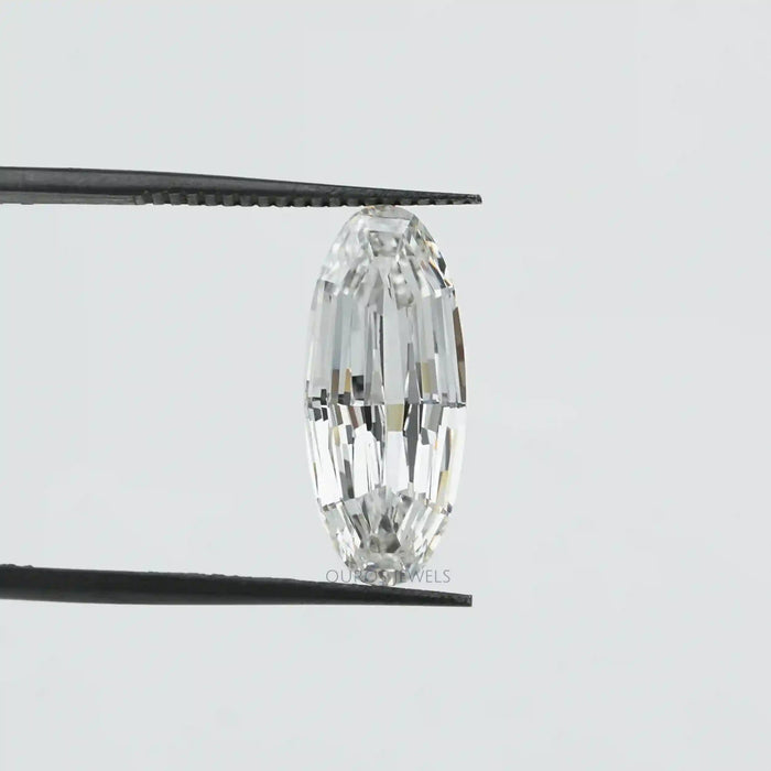 [an oval cut lab diamond being held by a pair of tweezers]-[Ouros Jewels]