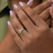 In finger front look of Old cut round diamond engagement ring studded with round accent stones