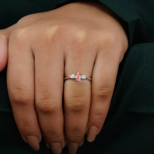 [A Women Wearing Three Diamond Pear Cut Engagement Ring]-[Ouros Jewels]