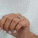 A Women Showing Round Diamond Anniversary Ring 