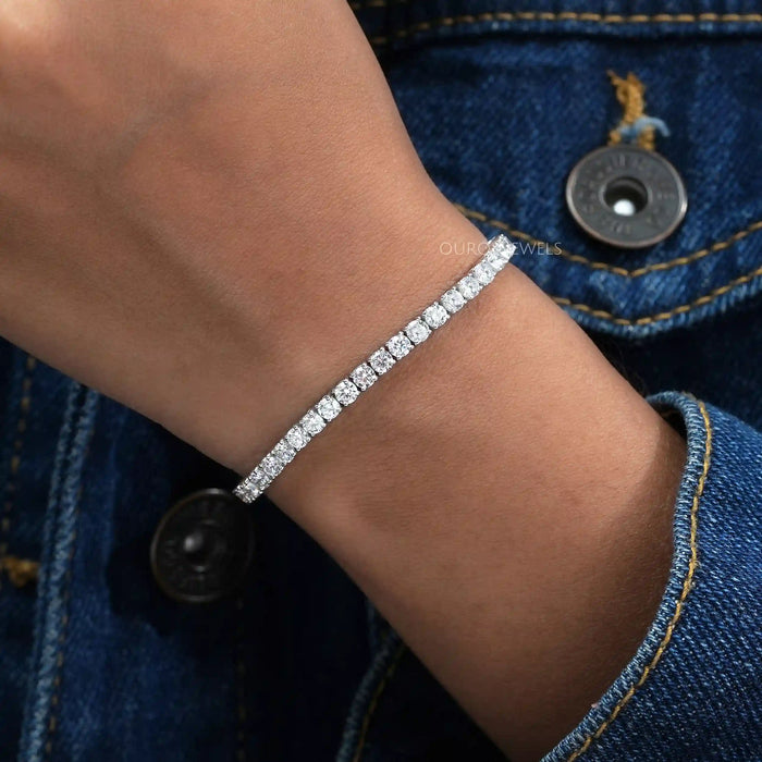 [ a women's wrist with a round lab diamond bracelet]-[Ouros Jewels]