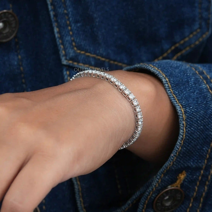 [a woman wearing a bracelet with diamonds on it]-[Ouros Jewels]
