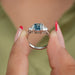 Zoomed look of blue emerald cut lab made diamond 3 stone engagement ring