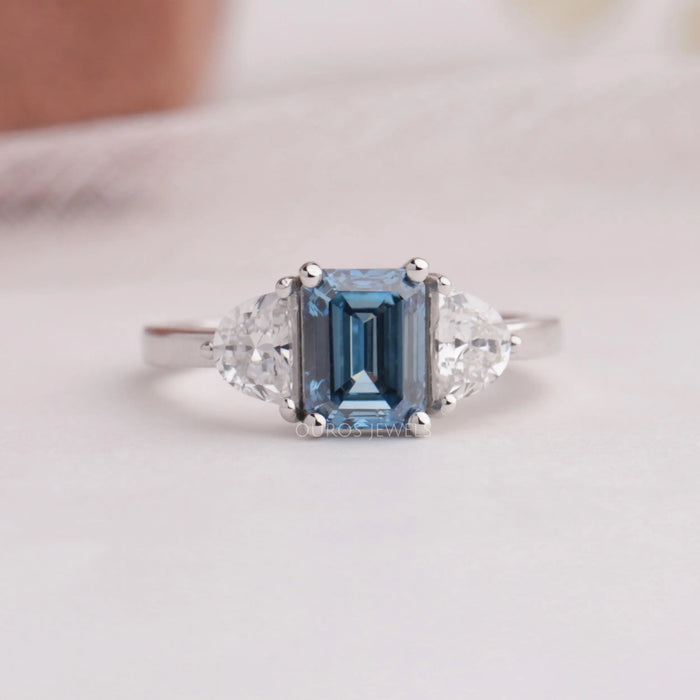 Blue emerald and half moon shaped lab diamond three stone engagement ring