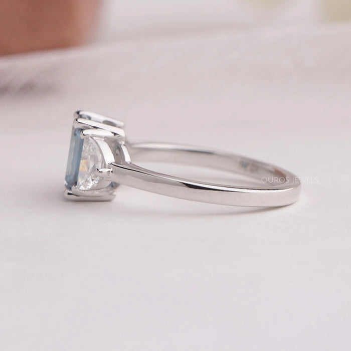 Blue emerald and half moon shaped lab diamond 3 stone engagement ring