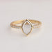 Step cut oval lab made diamond engagement ring with round accent stones in solid gold