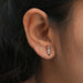 In ear look of bar stud earrings with baguette lab created diamonds