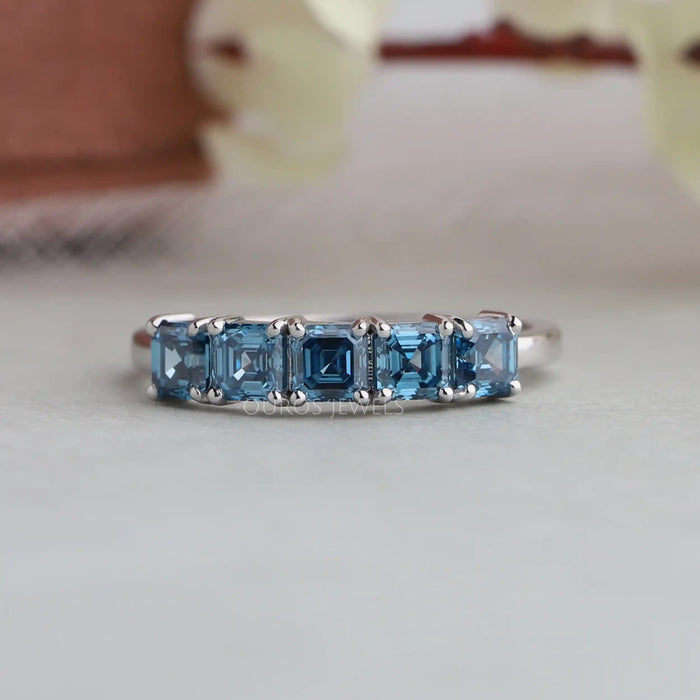 5 stone lab diamond engagement ring made with blue asscher diamonds in solid gold